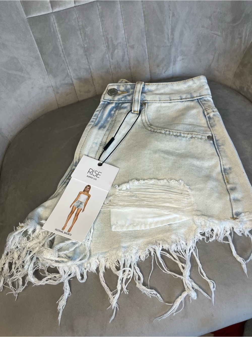 RISE Denim Distressed Fringe Mini Skirt in Light Blue Wash